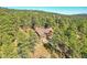 Secluded home nestled among the trees with a two-car garage and upper level deck at 24929 N Mountain Park Dr, Evergreen, CO 80439