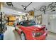 Attached garage featuring storage, a window for natural light, and space for a sports car at 24929 N Mountain Park Dr, Evergreen, CO 80439
