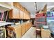 Functional garage with workbench and overhead cabinets for storing tools and supplies at 24929 N Mountain Park Dr, Evergreen, CO 80439