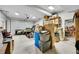 Spacious garage with overhead door, lighting, shelving, and room for storage at 24929 N Mountain Park Dr, Evergreen, CO 80439