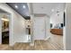 Hallway leading to rooms with hardwood flooring and natural light at 24929 N Mountain Park Dr, Evergreen, CO 80439