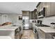 Stylish kitchen with stainless steel appliances, granite countertops, and custom backsplash at 24929 N Mountain Park Dr, Evergreen, CO 80439