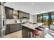 Contemporary kitchen with an island, granite counters, custom cabinets, and stainless appliances at 24929 N Mountain Park Dr, Evergreen, CO 80439