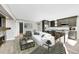 Open concept living area with kitchen, fireplace, and stylish decor at 24929 N Mountain Park Dr, Evergreen, CO 80439