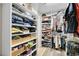Well-organized walk-in closet with shelves, hanging rods, and ample storage at 24929 N Mountain Park Dr, Evergreen, CO 80439