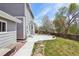 A beautiful backyard featuring a spacious concrete patio and mature trees at 882 W 96Th Ave, Thornton, CO 80260
