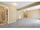 View of the carpeted basement, revealing an attached bathroom with a stand-up shower for convenience at 882 W 96Th Ave, Thornton, CO 80260