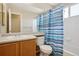 This bathroom has tile walls and a shower curtain at 882 W 96Th Ave, Thornton, CO 80260