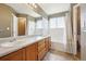This bathroom features a double sink vanity with shower and tub combo at 882 W 96Th Ave, Thornton, CO 80260