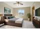 This bedroom features a ceiling fan, area rug, and an ensuite bathroom for a comfortable living experience at 882 W 96Th Ave, Thornton, CO 80260