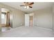 This bedroom is spacious and features a ceiling fan and adjoined bathroom access at 882 W 96Th Ave, Thornton, CO 80260