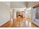 Open living space with hardwood floors and a kitchen featuring wooden cabinets and modern appliances at 882 W 96Th Ave, Thornton, CO 80260