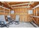 View of unfinished storage area with wood walls and several shelves at 882 W 96Th Ave, Thornton, CO 80260