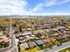 Expansive aerial view of the neighborhood showcasing the city skyline and beautiful landscaping at 2276 Newland St, Edgewater, CO 80214