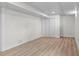 Unfurnished basement with modern flooring, neutral walls, and a closet offering a blank canvas at 2276 Newland St, Edgewater, CO 80214