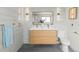 Stylish bathroom with dual sinks, modern lighting, and a toilet, creating a functional space at 2276 Newland St, Edgewater, CO 80214