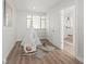 Charming bedroom with a white teepee, rocking animal, and window, creating a cozy and playful space at 2276 Newland St, Edgewater, CO 80214