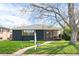 Charming single-story home with a well-manicured lawn and inviting curb appeal at 2276 Newland St, Edgewater, CO 80214