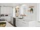 Contemporary kitchen featuring a clean design, floating shelves, and stylish countertops at 2276 Newland St, Edgewater, CO 80214