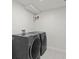 Convenient laundry room features modern gray washer and dryer at 2276 Newland St, Edgewater, CO 80214