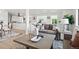 Cozy living room with stylish furniture, open floor plan, and seamless access to the kitchen and dining area at 2276 Newland St, Edgewater, CO 80214