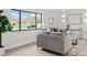 Cozy living room with modern decor, a large window, and comfortable seating at 2276 Newland St, Edgewater, CO 80214