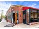 Inviting retail building with wooden door and partially covered patio at 2276 Newland St, Edgewater, CO 80214