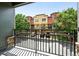 View from balcony showcases well-maintained condo community, manicured landscaping, and parking at 13524 Via Varra, Broomfield, CO 80020
