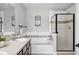 Bright bathroom with a soaking tub and a separate glass-enclosed shower at 13524 Via Varra, Broomfield, CO 80020