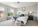 Calm bedroom featuring plush carpets, natural light, and neutral tones at 13524 Via Varra, Broomfield, CO 80020