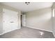 Neutral bedroom featuring plush carpet, white closet doors, and lots of natural light at 13524 Via Varra, Broomfield, CO 80020