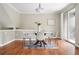 Dining room with wooden floors and sliding door access to a balcony for al fresco dining at 13524 Via Varra, Broomfield, CO 80020