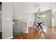 Bright dining room with hardwood floors and modern lighting fixtures at 13524 Via Varra, Broomfield, CO 80020