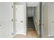 Inviting entryway with neutral paint, tile flooring, and carpeted stairs to the upper level at 13524 Via Varra, Broomfield, CO 80020