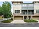 Stylish townhome with a two-car garage, stone accents, and attractive landscaping at 13524 Via Varra, Broomfield, CO 80020