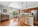 Eat-in kitchen with great natural light, barstool seating at the counter and stainless steel appliances at 13524 Via Varra, Broomfield, CO 80020