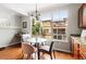 Kitchen nook has a table with seating and a large window for plenty of natural light at 13524 Via Varra, Broomfield, CO 80020