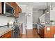 This kitchen has granite countertops, stainless steel appliances and hardwood floors at 13524 Via Varra, Broomfield, CO 80020