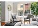 Bright living room area featuring hardwood floors and large windows with great light at 13524 Via Varra, Broomfield, CO 80020