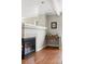 Cozy living room with hardwood floors, a fireplace, and a built-in countertop at 13524 Via Varra, Broomfield, CO 80020