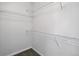 Empty walk-in closet with wire shelving, ready for organizing your wardrobe and accessories at 13524 Via Varra, Broomfield, CO 80020