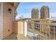 Cozy balcony showcasing city views and nearby buildings against a clear blue sky at 3000 E 16Th Ave # 320, Denver, CO 80206