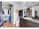 Bathroom with a marble countertop vanity, toilet, and open closet space at 3000 E 16Th Ave # 320, Denver, CO 80206