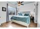 Inviting bedroom with a bed, soft bedding, a window, and a bedside table at 3000 E 16Th Ave # 320, Denver, CO 80206