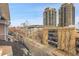 Scenic view from the roof overlooking the city, garage, and surrounding apartments at 3000 E 16Th Ave # 320, Denver, CO 80206