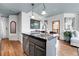 Stylish kitchen island with a stainless steel sink, modern appliances, and ample cabinet space at 3000 E 16Th Ave # 320, Denver, CO 80206