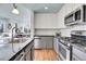 Well-equipped kitchen with stainless steel appliances and sleek countertops in a cozy home at 3000 E 16Th Ave # 320, Denver, CO 80206