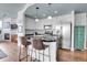 Modern kitchen featuring stainless steel appliances, granite countertops, and an island with barstool seating at 3000 E 16Th Ave # 320, Denver, CO 80206