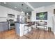 Well-appointed kitchen boasting stainless steel appliances, an island, and stylish finishes at 3000 E 16Th Ave # 320, Denver, CO 80206