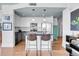 Open kitchen featuring stainless steel appliances, sleek countertops, and a convenient island at 3000 E 16Th Ave # 320, Denver, CO 80206